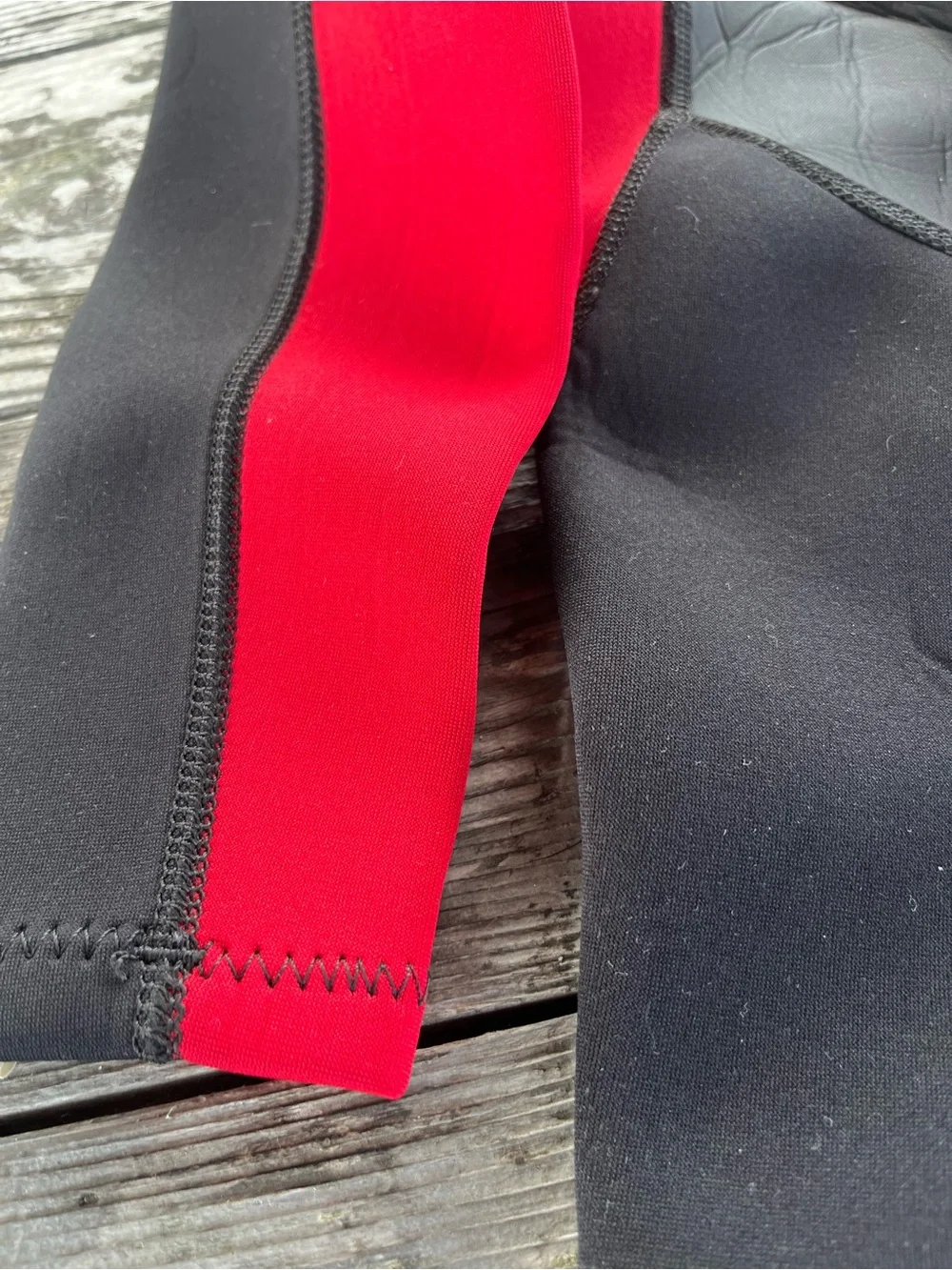 Kids Black and Red Wetsuit -soles up front 10/12 approx